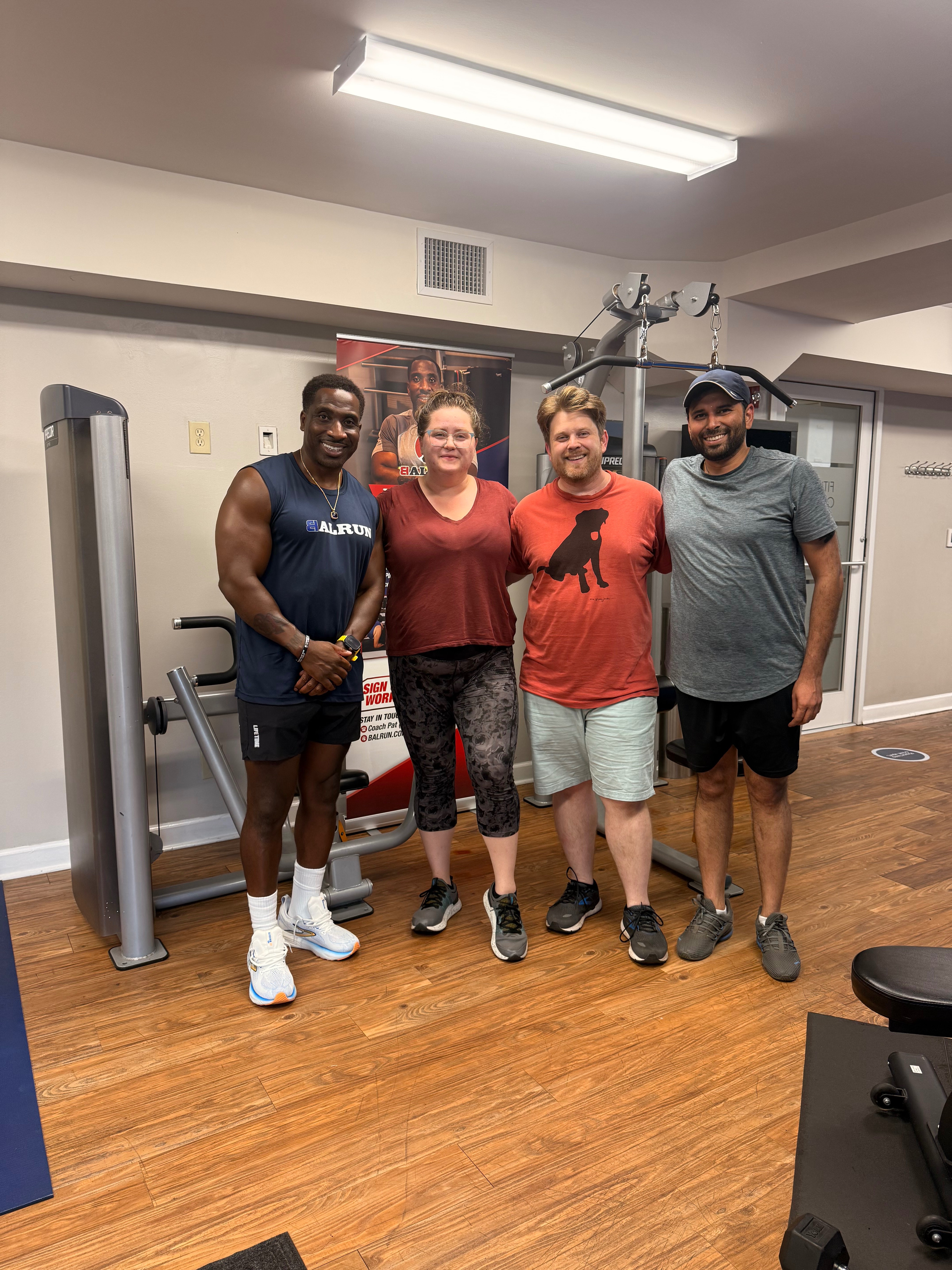 Coach Pat and Forever Strong program participants celebrating in gym