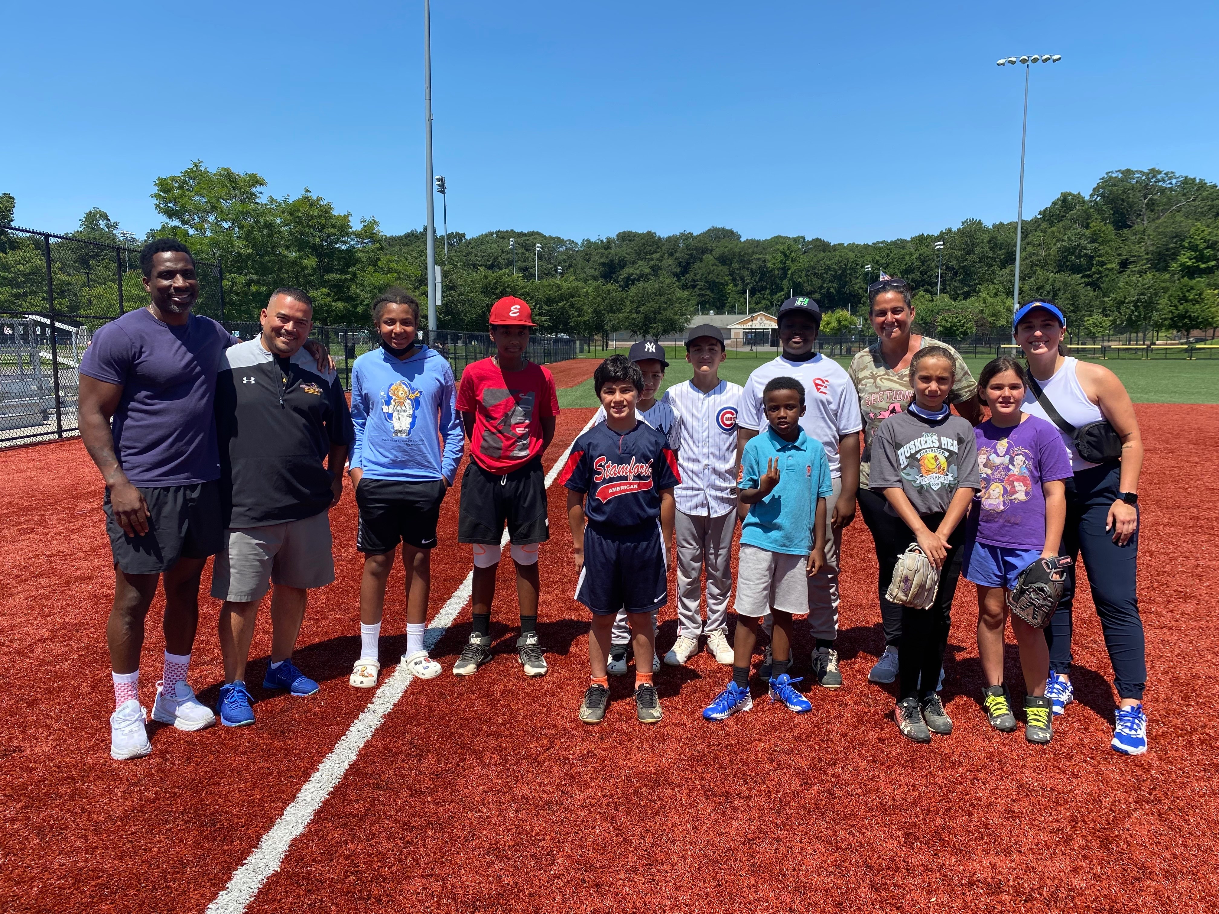 NIKE RBI program coaches and youth participants on baseball field